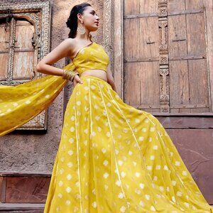 Yellow Foil Print Lehenga With One Shoulder Blouse And Attached Drape